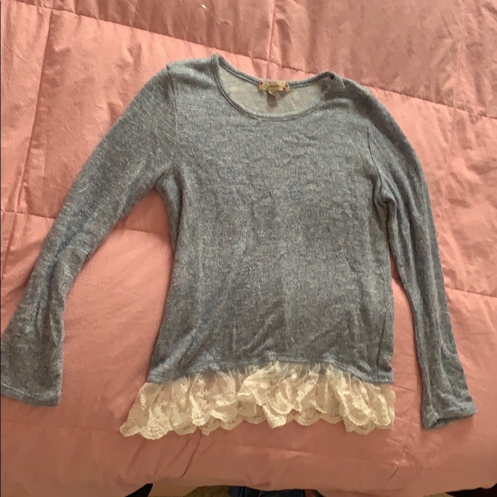 Light blue sweater with lace at bottom